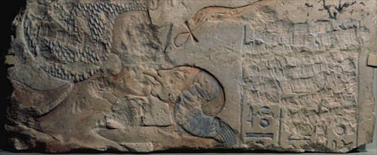Relief showing Nefertiti kissing her daughter, perhaps Merytaten, under the rays of the Aten