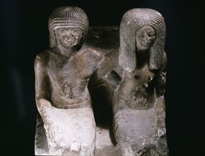 Pair statue of the fan bearer Mery and his wife Saty, incribed as an offering to Horus at Edfu
