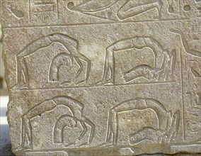 Detail of a relief depicting backward bending acrobats, originally from the Red Chapel of Hatshepsut