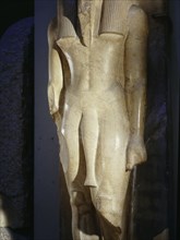 Statue of a 17th or 18th dynasty king wearing an unusual early form of dress