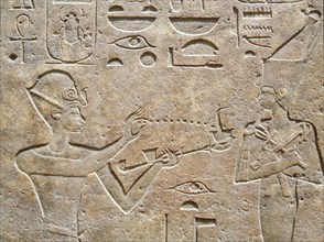 Detail of a relief showing Queen Hatshepsut burning incense to honour a god
