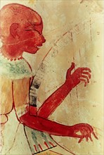 A detail of a painting from the tomb of Nakht depicting a blind harpist at a banquet
