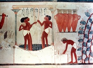 A detail of a painting from the tomb of Nakht depicting the treading of the grapes and the storage of the wine in jars