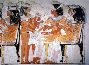 A detail of a wall painting from the tomb of Nebamun depicting two guests at a banquet