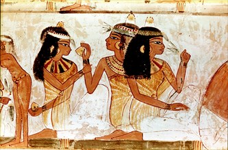A detail of a painting from the tomb of Nakht depicting three ladies at a feast