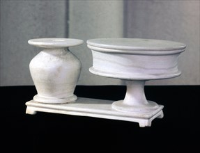 A double kohl tube for cosmetics and ointments, carved out of a single piece of alabaster