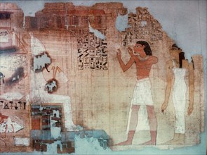 A vignette from a Book of the Dead in which the dead man and his wife can be seen praying before Osiris