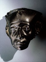 An obsidian head, thought to be part of a statue depicting Senwosret III as a middle aged man