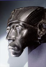 An obsidian head, thought to be part of a statue depicting Senwosret III as a middle aged man