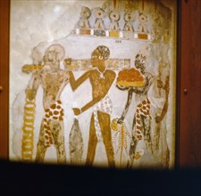 Fragment of a wall painting from the tomb chapel of Sobekhotep, showing Nubians presenting exotic gifts to Tuthmose IV