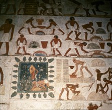 A detail of a wall painting in the tomb of Rekhmire showing a team of workmen making mud bricks