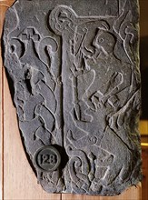 The Andreas Stone with a relief depicting a scene from the legendary Norse poem Ragnarok, Doomsday of the Gods, in which the god Odin is eaten by the wolf Fenrir