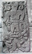 The Bound Devil on a cross at Kirkby Stephen, Cumbria
