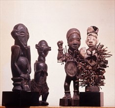 The two right hand figures are Kongo power sculptures, minkisi