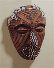 A mask known as Ngady Amwaash, representing Mweel, sister of the founding ancestor Woot