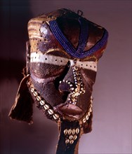 A helmet mask known as Mboom or Bwoom representing local pygmies, the common people, in a play retelling the myth of Bushoong royal origins, performed at major funerals, royal ceremonies and initiatio...