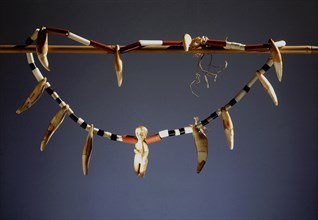 Hunters necklace made from ivory pendants, jaguar teeth and glass beads