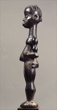 A standing figure with scarification design which was used in the Chibola cult