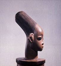 Anthropomorphic bark box, depicting the womens headdress and cranial modification achieved by binding the heads of babies among the Mangbetu