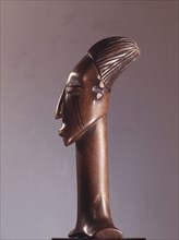 Ceremonial knife handle, depicting the womens headdress and cranial modification achieved by binding the heads of babies among the Mangbetu