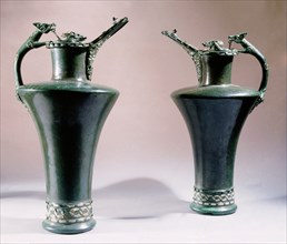 Pair of bronze jugs inlaid with coral and enamel