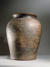 A ceramic cremation urn found in the funeral mound of Lann Tinikei at Plomeur, Morbihan