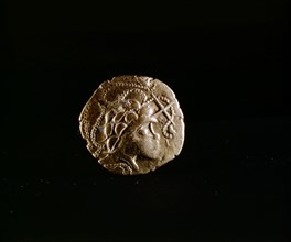 Coin showing a head surrounded by Ss, a favorite motif of the Armorican people