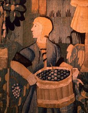 A detail of a tapestry depicting work in the vineyards