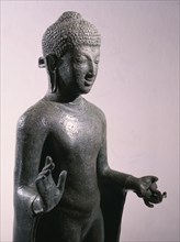 Statue of Buddha, with his right hand in abhayamudra (promise of freedom from fear)