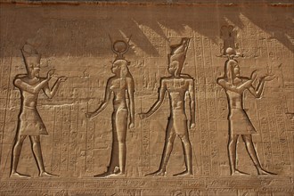 Reliefs on the outer back walls of the temple complex depicting a pharaoh burnign incense for the goddess Isis