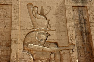 Outer wall of the Pylon relief depicting Horus the Elder wearing the crowns of upper and lower Egypt