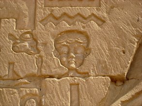 Caricature relief of a Nubian face from the outer wall of the Pylon