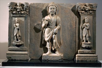 Frieze with depiction of the Reassuring Maitreya flanked by two donors