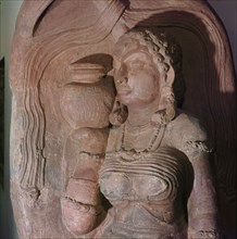 A stele depicting a river goddess who holds a jug of water on her shoulder
