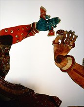 Detail of shadow puppet, shows the hands of a prince, decorated with rings