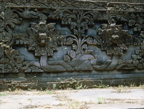 Stone relief on a temple wall at Sangsit, Buleleng