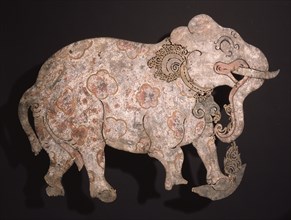 Wayang shadow puppet of an elephant painted with flowers, used in popular all night performances, usually based on ancient Hindu epics such as the Ramayana