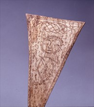 Bone amulet, inscribed by a Batak shaman with a spirit figure, pentacles, writing and other designs from their magic books