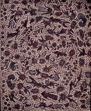 Detail of a batik kain with a design including wings, shrines and sacred mountains