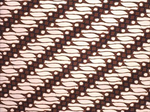 Detail of a batik kain with a variant of the scrolled parang motif once restricted to royal use