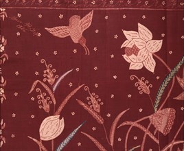 A detail of the design on a batik sarong which incorporates herons and other birds, flowers and water plants