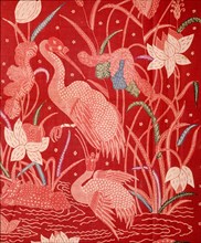 A detail of the design on a batik sarong which incorporates herons and other birds, flowers and water plants