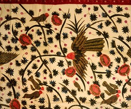 A detail of the design on a batik sarong which incorporates birds, flowers and water plants