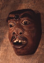 A mask, representing a diseased or deformed person, used in wayang wong performances of the Hindu epics, especially the Ramayana