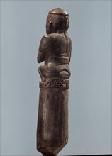A stopper in the form of a Chinese or Malay man