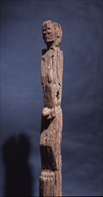 This figurative carving may be a bogy, serving as a site for a village guardian spirit, deterring strangers and enemies