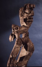 This figurative carving may be a bogy, serving as a site for a village guardian spirit, deterring strangers and enemies