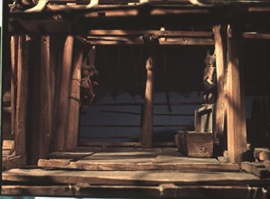Model of a Nias spirit or ghost house, which ancestral spirits, represented by the carved figures, were expected to inhabit