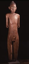 Regarded as a portrait of the deceased, a tau tau figure was dressed in his or her clothes and stood guard over the body on a balcony of the tomb cut into the cliff face