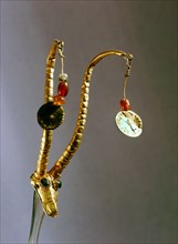Rare earring or part of a diadem in the form of a gazelle